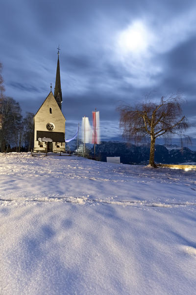 The church of Santa Croce was built in 1896 and its bell tower is 33 meters high. Camminata/Kematen, Renon plateau, Bolzano province, Trentino Alto-Adige, Italy, Europe.