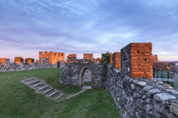 Sunset on the crenellated walls of the Rocca (Fortress) di Lonato. Lonato del Garda, Brescia province, Lombardy, Italy, Europe.