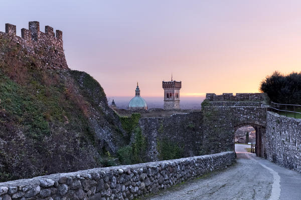 Crenellated walls of the Rocca di Lonato, the civic tower and the Basilica of Lonato del Garda. Brescia province, Lombardy, Italy, Europe.