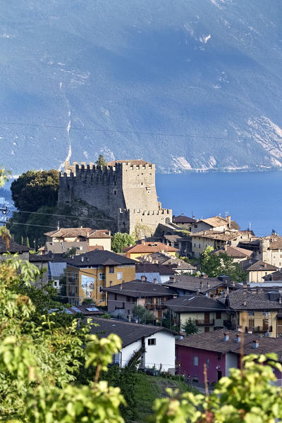 The medieval castle and the ancient village of Tenno. In the background Lake Garda. Trento province, Trentino Alto-Adige, Italy, Europe.