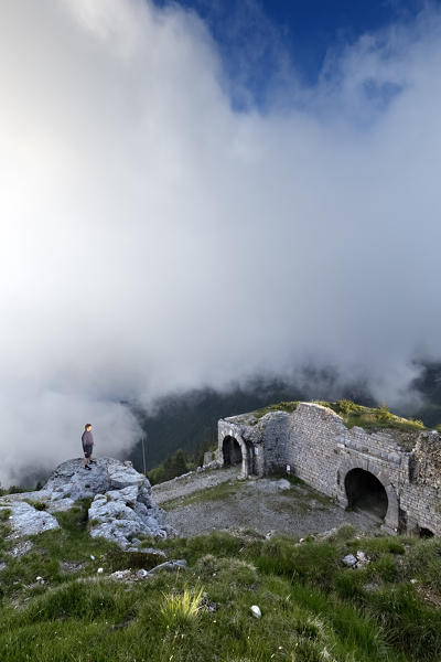 Man stands in front of Fort Campomolon. Arsiero, Vicenza province, Veneto, Italy, Europe.