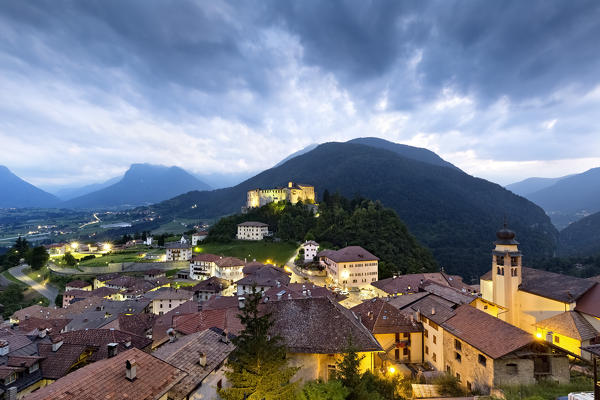 Evening falls on the castle and the village of Stenico. Giudicarie, Trento province, Trentino Alto-Adige, Italy, Europe.