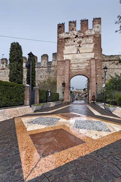 The Lion gate is an entrance to the fortified village of Lazise on Lake Garda. Verona province, Veneto, Italy, Europe.