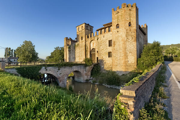 The medieval castle of Valbona surrounded by a moat full of water. Lozzo Atesino, Padova province, Veneto, Italy, Europe.