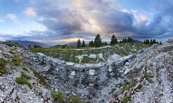 Sunset on the ruins of the casemate of the fort Dosso delle Somme. Folgaria, Alpe Cimbra, Trento province, Trentino Alto-Adige, Italy, Europe.