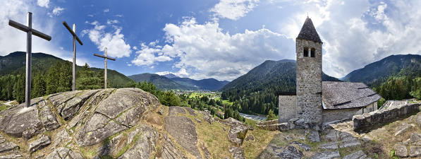 The medieval Santo Stefano church and the Rendena valley with the towns of Carisolo and Pinzolo. Trento province, Trentino Alto-Adige, Italy, Europe.