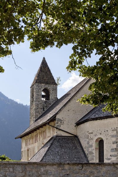 The Romanesque church of San Vigilio in Pinzolo with the Macabre Dance fresco by the painter Simone II Baschenis. Rendena Valley, Trento province, Trentino Alto-Adige, Italy, Europe.