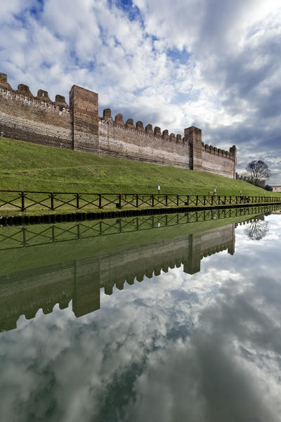 Cittadella: medieval towers and walls are reflected in the moat. Padova province, Veneto, Italy, Europe.