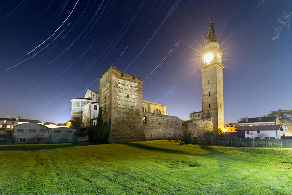 Cologna Veneta: star trail above the Scaliger tower and the bell tower. Verona province, Veneto, Italy, Europe.