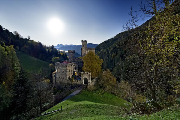 Gernstein Castle on a full moon night. Built in the Middle Ages, it was restored in the 19th century in a neo-Gothic style. Chiusa, Bolzano province, Trentino Alto-Adige, Italy, Europe.