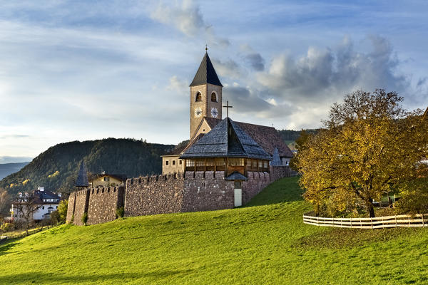 Autumn at the parish church of Santa Croce in Siusi allo Sciliar. Castelrotto, Bolzano province, Trentino Alto-Adige, Italy, Europe.