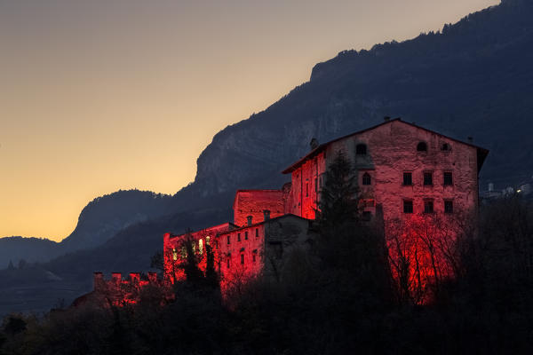 Twilight over the Noarna castle. In the 17th century it was the scene of a famous witch trial. Nogaredo, Trento province, Trentino Alto-Adige, Italy, Europe.