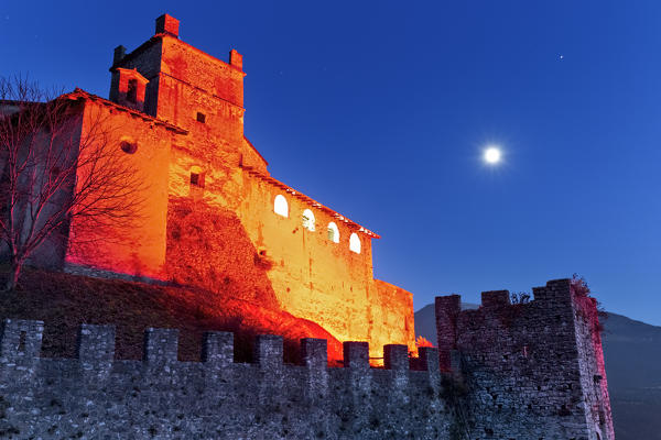 Ghostly night at the Noarna castle. In the 17th century it was the scene of a famous witch trial. Nogaredo, Trento province, Trentino Alto-Adige, Italy, Europe.