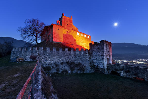 Full moon night at the Noarna castle. In the 17th century it was the scene of a famous witch trial. Nogaredo, Trento province, Trentino Alto-Adige, Italy, Europe.