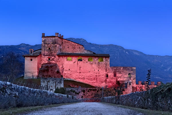 The Noarna castle at dusk. In the 17th century it was the scene of a famous witch trial. Nogaredo, Trento province, Trentino Alto-Adige, Italy, Europe.