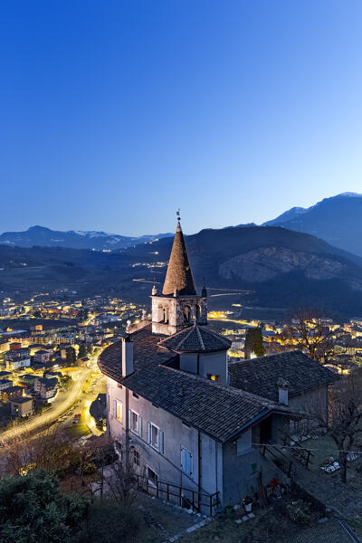 The church of Montalbano and the town of Mori. In the background the Brentonico plateau. Vallagarina, Trento province, Trentino Alto-Adige, Italy, Europe.