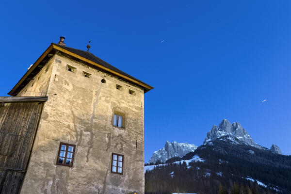 The Pozza tower is a 17th century building in front of the Mount Sas da le Doudesh. San Giovanni di Fassa, Fassa Valley, Trento province, Trentino Alto-Adige, Italy, Europe. 