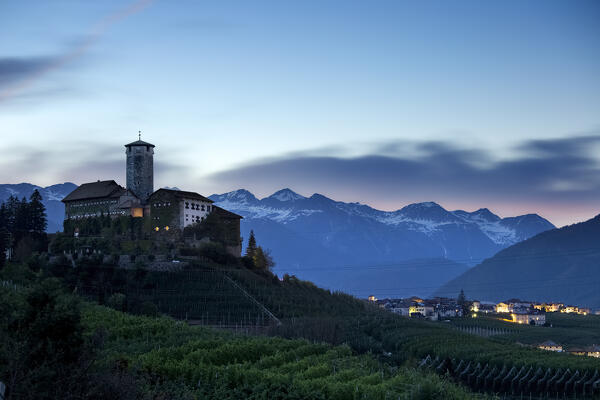 Valer Castle and the village of Tassullo are surrounded by apple orchards. Non Valley, Trento province, Trentino Alto-Adige, Italy, Europe.