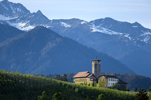 The Maddalene mountains frame the medieval Valer Castle. Tassullo, Non Valley, Trento province, Trentino Alto-Adige, Italy, Europe.