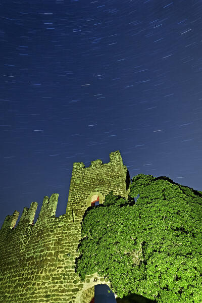 The fairytale ruins of Aichach Castle (or Rovereto) on a moonless night. Castelrotto/Kastelruth, Bolzano province, Trentino Alto-Adige, Italy, Europe. 