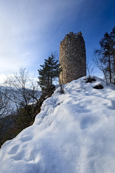 The cylindrical tower of San Pietro Castle rise in an isolated and wild place of the Rinassico Valley. Ton, Trento province, Trentino Alto-Adige, Italy, Europe.