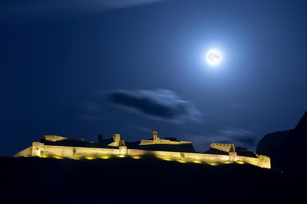 Beseno Castle: the largest medieval fortification in Trentino on a full moon night. Besenello, Trento province, Trentino Alto-Adige, Italy, Europe.