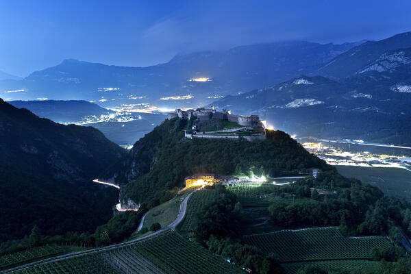 Beseno Castle and Vallagarina on a full moon night. Besenello, Trento province, Trentino Alto-Adige, Italy, Europe.