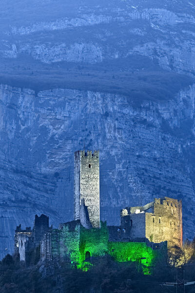 The medieval ruin of Drena castle stands out against the rocky walls of Casale Mount. Drena, Laghi Valley, Trento province, Trentino Alto-Adige, Italy, Europe. 