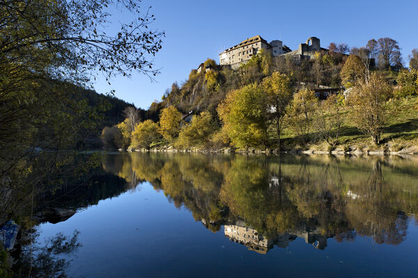 The medieval Badia Castle (Sonnenburg) is reflected in the Rienza River. San Lorenzo di Sebato / St. Lorenzen, Pusteria Valley, Bolzano province, Trentino Alto-Adige, Italy, Europe. 