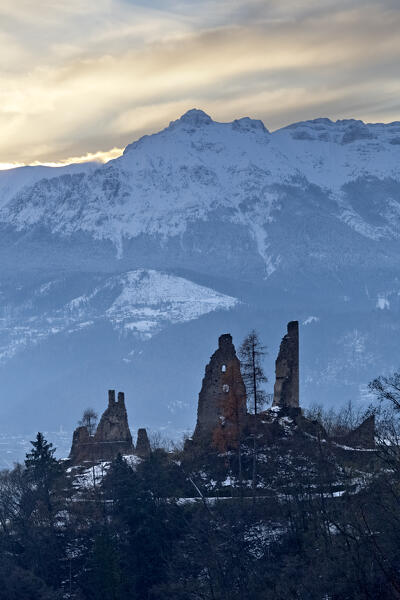 The medieval ruins of Selva Castle and mount Vigolana in winter. Levico Terme, Trento province, Trentino Alto-Adige, Italy, Europe.