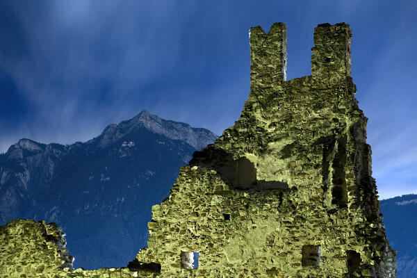 The spooky ruins of Selva Castle and mount Cima Vezzena in winter. Levico Terme, Trento province, Trentino Alto-Adige, Italy, Europe.