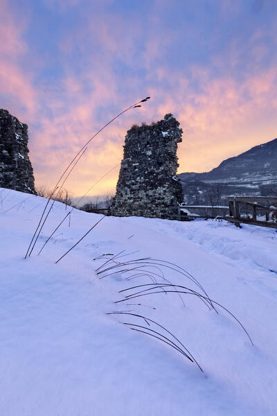 Winter sunset over the medieval ruins of Pradaglia Castle. Isera, Vallagarina, Trento province, Trentino Alto-Adige, Italy, Europe.