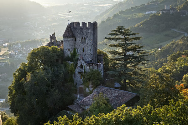 Castel Fontana/Brunnenburg. In the background Lagundo and the entrance to the Venosta valley. Tirol/Tirolo, Bolzano province, Trentino Alto-Adige, Italy, Europe.