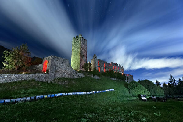 Spooky night in the ruins of Belfort Castle. In the foreground the hives for beekeeping. Spormaggiore, Trento province, Trentino Alto-Adige, Italy, Europe.
