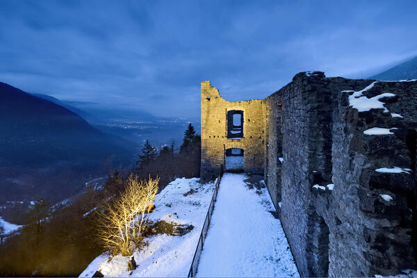 The medieval ruins of the noble palace of Belfort castle. In the background the Non valley. Spormaggiore, Trento province, Trentino Alto-Adige, Italy, Europe.
