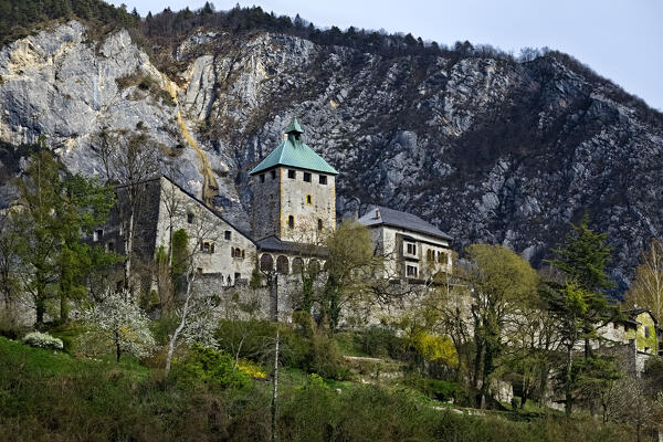 Ivano castle is an imposing medieval fortified structure in the Gothic style. In the background the mount Lefre. Castel Ivano, Trento province, Trentino Alto-Adige, Italy, Europe.