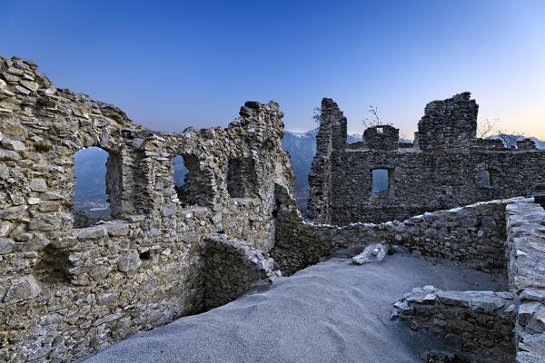 Ruins of the medieval wall with loopholes of Castellalto castle. Telve, Trento province, Trentino Alto-Adige, Italy, Europe.