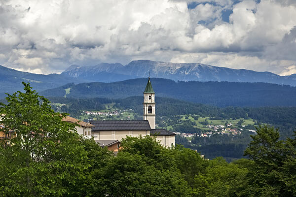 The church of the mountain village of San Sebastiano. Folgaria, Alpe Cimbra, Trentino, Italy, Europe.