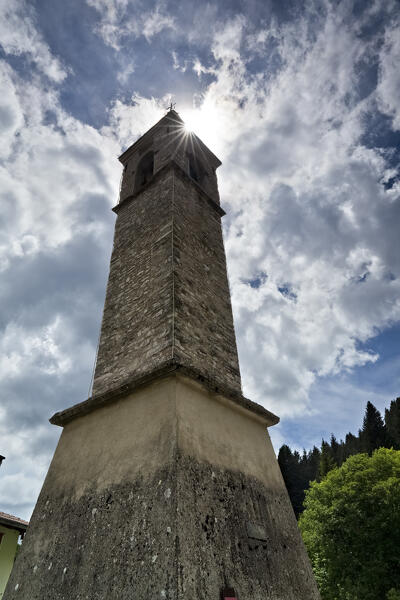 Romanesque bell tower in the village of San Sebastiano. Folgaria, Alpe Cimbra, Trentino, Italy.