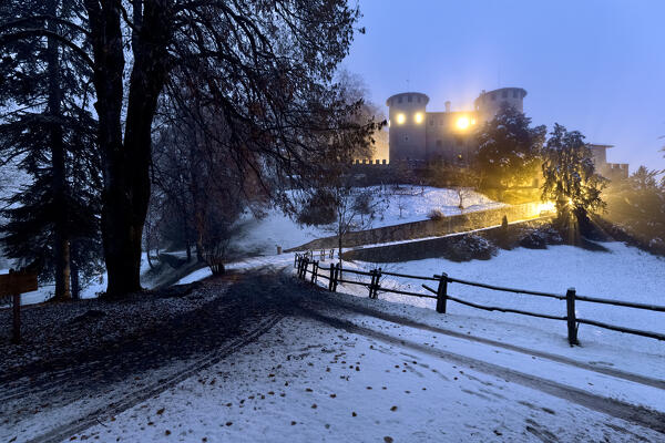 The medieval castle of Campo in snowy winter. Campo Lomaso, Giudicarie, Trentino, Italy.