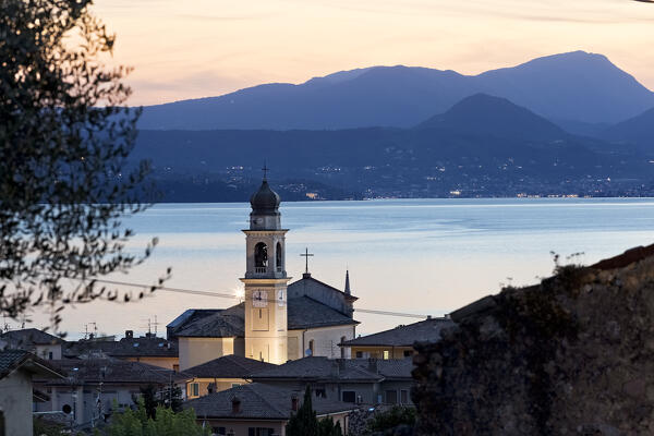 The village of Torri del Benaco with the church of San Pietro e Paolo. In the background Lake Garda. Veneto, Italy.