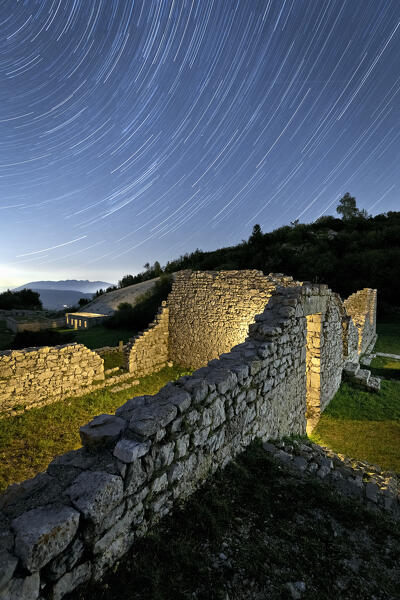 Peace Park on a starry night: vestiges of the Italian hospital of the Great War on Monte Zugna. Rovereto, Trentino, Italy.