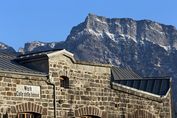 Fort Colle delle Benne: the facade of the Habsburg fort and in the background the peak of Cima Vezzena. Levico Terme, Trentino, Italy.