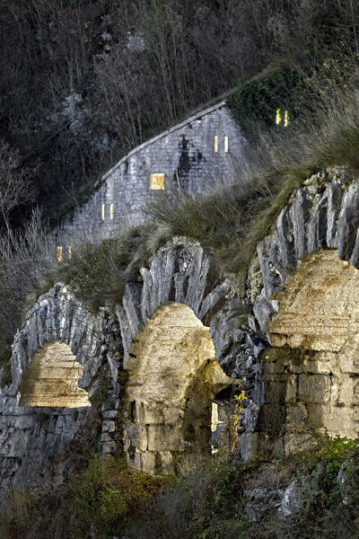 Tagliata della Scala: Illuminated arches of the 19th-century fortress. Primolano, Veneto, Italy.