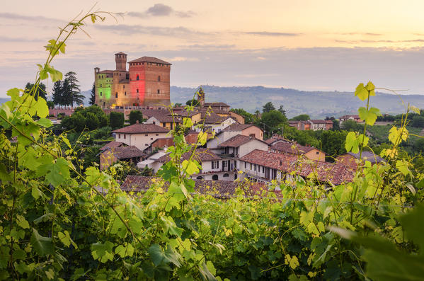 Grinzane Cavour Castle through the vineyards coloured with the italian flag, Grinzane Cavour, Piedmont, Italy