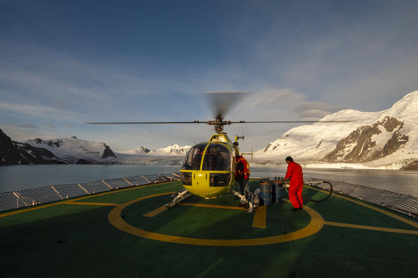 Antarctica, South Shetlands Islands, Livingston Island, Helicopter landing on Antarctic Dream ship.