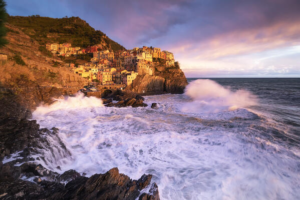 Dream sunset during a storm over the village of Manarola, Cinque Terre National Park, municipality of Riomaggiore, La Spezia province, Liguria district, Italy, Europe
