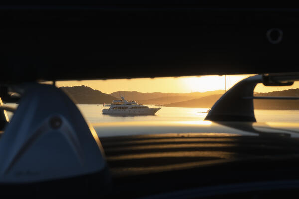 Alternative viewpoints at sunset on yacth moored in front of Cala Andreani, Caprera Island, archipelago of the Maddalena, Sassari province, Sardinia, Italy, Europe.