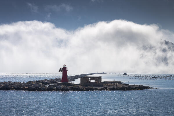 Maritime fog on the dam of the port of la spezia, La Spezia province, Liguria district, Italy, Europe.