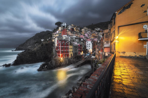 Cloudy evening over the village of Riomaggiore, National Park of Cinque Terre, municipality of Riomaggiore, La Spezia province, Liguria district, Italy, Europe
